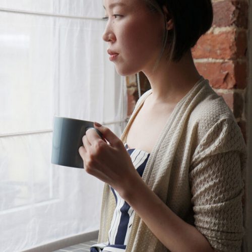 Woman Drinking Coffee At Home